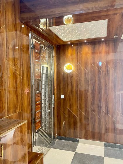 Another angle of the main door panelling, showing the glossy finish and the warm lighting that creates a welcoming ambiance.
