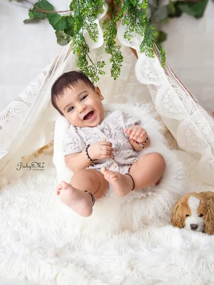 I love the pure happiness in this photo. The simple, bright setup keeps all the attention on his adorable smile.
