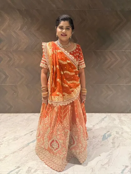 Here is one of my happy clients looking radiant in our rented orange and red bandhani style lehenga. It’s perfect for a wedding guest or even for a bride's smaller function.