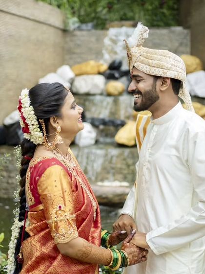 A classic couple portrait, sharing a look of love in a beautiful garden setting.