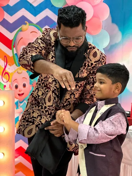 A moment of close-up magic with a young guest. I make sure every child feels involved and gets to experience the wonder firsthand at birthday celebrations.
