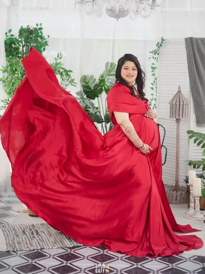 A mother-to-be glowing in a stunning red gown. Maternity sessions are a celebration of strength and beauty, and I love using flowing fabrics and elegant poses to create truly breathtaking portraits.