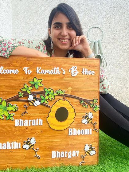 Buzzing with happiness for this 'B Hive' nameplate. I designed this for a family whose names all start with 'B'. The large wooden board features a beehive, cute bee illustrations, and all the family members' names in 3D acrylic.