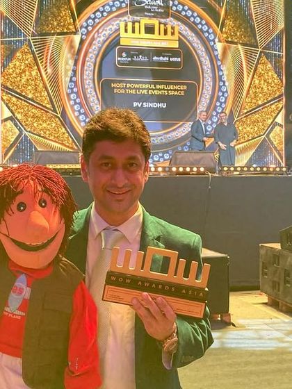 Another shot from the WOW Awards, holding the trophy for 'Best Influencer for Social Awareness'. Using my art for a good cause is incredibly fulfilling.