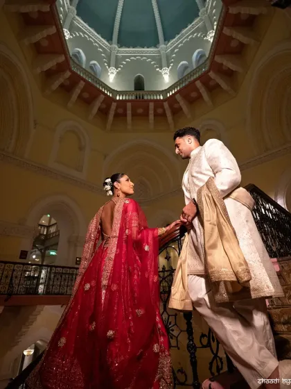 A moment of quiet grandeur. I love using dramatic architecture to frame a couple's story, making their portrait feel as epic as their love is. This is a classic editorial shot from a Mumbai wedding.