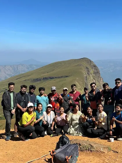 The New Year's trekking batch posing for a group photo on the sunny slopes of Nethravathi.