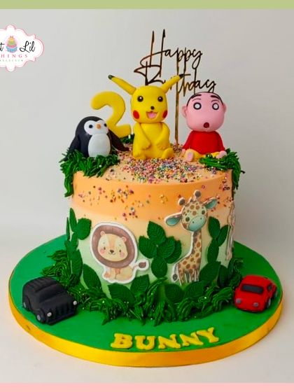 A fun and colorful cake featuring a mix of beloved characters, including Pikachu and Shinchan, alongside jungle animals. It's a playful and imaginative choice for a 2nd birthday.