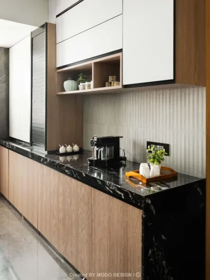 Here, we focused on creating spacious counters for effortless prep and smart storage to keep everything organized. The black marble countertop provides a durable and stylish surface for daily use.
