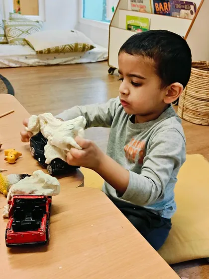 Playdough is a staple in our classrooms for a reason. Combined with loose parts like natural items or toy cars, it becomes an open-ended material for building fine motor skills, expressing creativity, and engaging in imaginative storytelling.