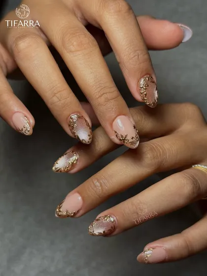 Another angle of the hand-drawn golden floral set, highlighting the shimmer of the cat-eye base.