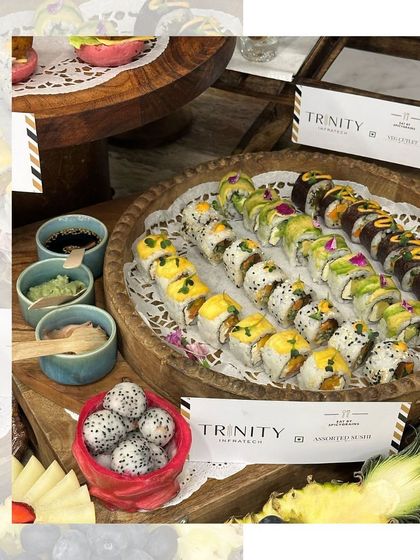 A beautiful platter of assorted sushi, showcasing a variety of rolls and fresh ingredients. We catered this spread for an event with Trinity, a Japanese restaurant.