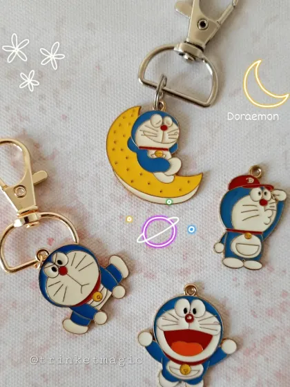 For the love of Doraemon! This collection features multiple adorable Doraemon charms, including one of him resting on a crescent moon.