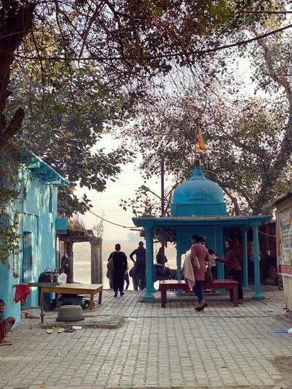 A colorful temple on the riverbank provides a serene spot for locals. Our walk explores these places of daily life and worship along the Yamuna.