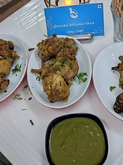 A platter of our Chicken Afghani Tikka, beautifully presented with mint chutney, ready to be served at a house party.