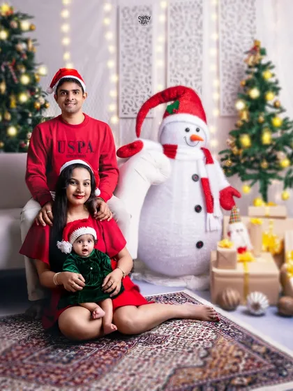 A beautiful family portrait in matching red outfits, capturing the warmth and love of the holiday season.