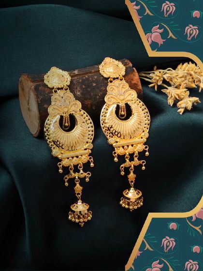 Unleash your inner diva with these unique gold earrings. The intricate design and dangling elements create a sense of movement and elegance.