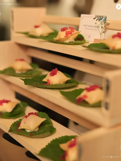 Delicate parcels topped with pomegranate seeds, served on individual leaves. This appetiser showcases our attention to detail and our love for creating beautiful, bite sized art.
