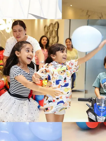 Pure joy and excitement. The kids having a blast at the Spider-Man themed party, surrounded by balloons and fun.