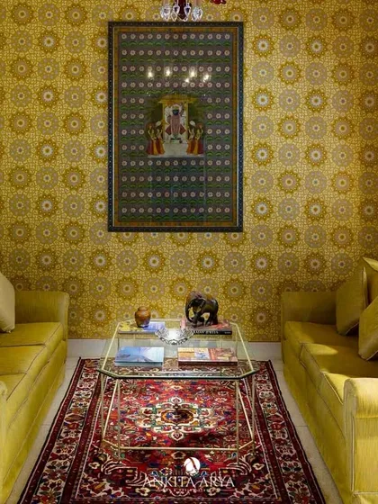 A sitting room at the Nivah heritage property, featuring my Mughal-inspired jaali wallpaper in a vibrant yellow. The design adds warmth and historical context, making the space feel both luxurious and authentic.