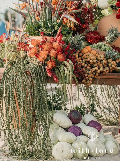 Another view of the abundant fruit and floral installation on the beach.