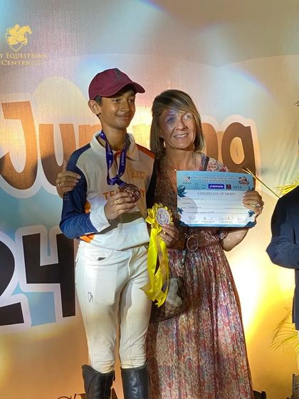 Mohak celebrating his third-place finish at the NASR championship. His hard work in training is clearly visible in the competition arena.