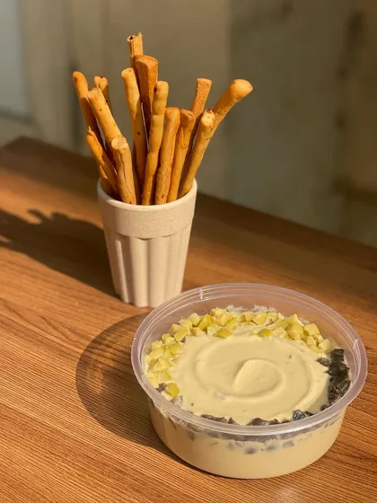 My olive and jalapeño hummus offers a tangy and spicy kick. It's a crowd-pleaser that pairs wonderfully with my plain or seasoned breadsticks.