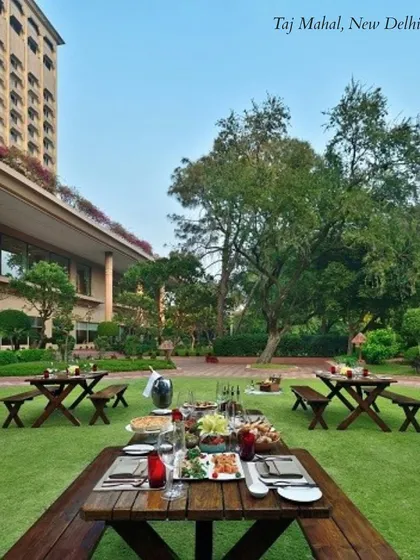 The lush lawns of the Taj Mahal hotel in New Delhi, a perfect spot for an elegant outdoor winter wedding or a sophisticated garden party.