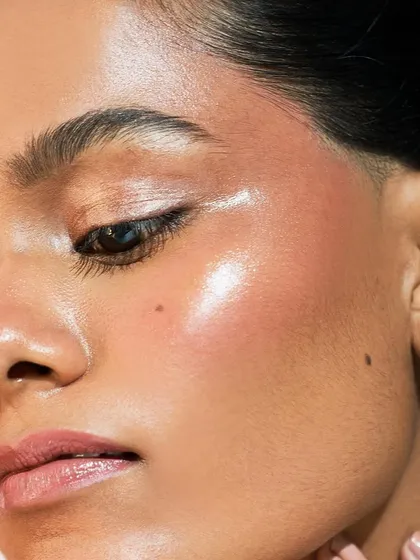 A macro view of the "Nam Glow." Notice how the highlighter catches the light on the cheekbone, creating a stunning, almost wet look.