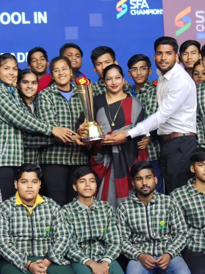 Receiving the 'Best School in Kabaddi' trophy at the SFA Championship. A proud moment for me and my players.