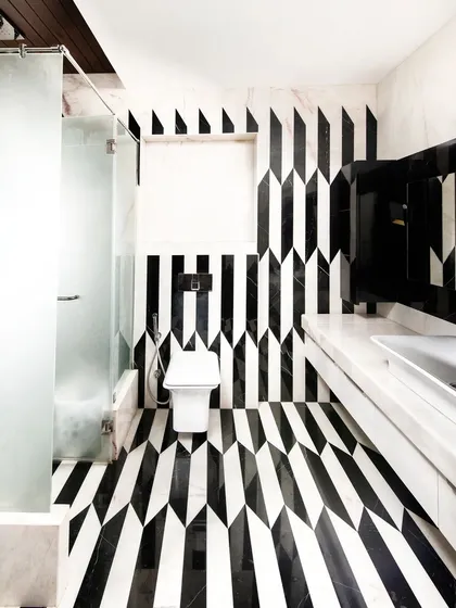 We believe in the power of detail. This bathroom, with its bold marble inlay work, shows our commitment to craftsmanship and creating moments of unexpected beauty. It’s an example of how even the most functional spaces can be transformed into art through thoughtful material selection and execution.