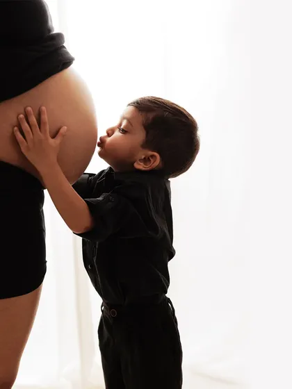 When your family is growing, we capture the love that multiplies. There is nothing more precious than a sibling's gentle kiss for their new brother or sister. These are the moments that turn your photoshoot into a family treasure.