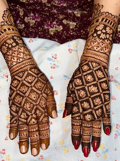 A striking design with a bold checkerboard pattern filled with lotus motifs, covering the entire hand for a full and impactful look.