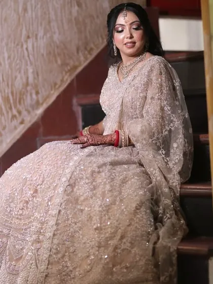 A quiet moment for the bride-to-be. This engagement look in a beautiful beige lehenga is all about soft, ethereal glam.