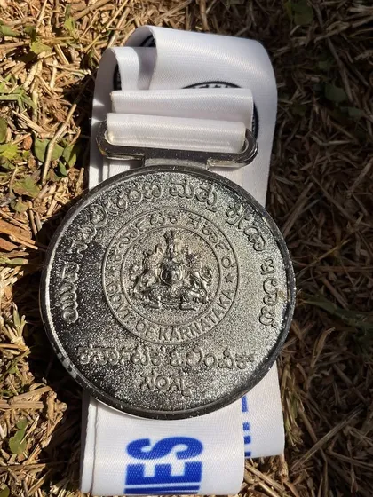 A close-up of the silver medal from the Netball State Games 2025, a symbol of the hard work and dedication of our athletes.