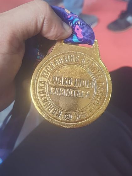 A close-up of the gold medal from the district championships. A symbol of hard work and dedication.