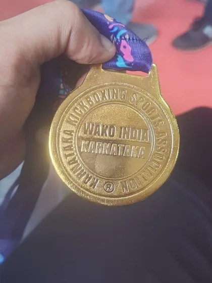 A close up of a WAKO India gold medal from the district championships. This represents the high level of competition and achievement my students can aspire to.