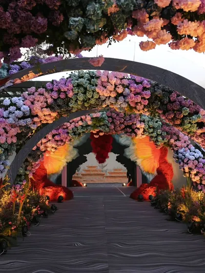 Another view of the floral archway tunnel, this time leading towards the butterfly wing entrance, showing how I connect different decor zones seamlessly.