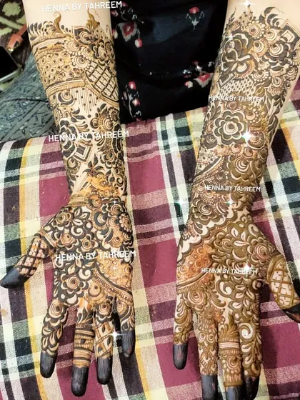 A great example of a full coverage bridal design with dark, filled-in fingertips, which is a very traditional and popular choice.