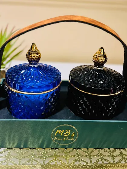 This gift set features two of my crystal jar candles, here in royal blue and black, presented in a stylish tray with a leather handle. It's a sophisticated and ready-to-give present for any occasion.