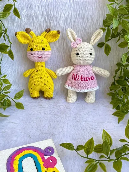 A classic duo, the giraffe and the bunny! This bunny is personalized with the name "Nitaya" on her pink dress. These make a wonderful gift set for a new baby.