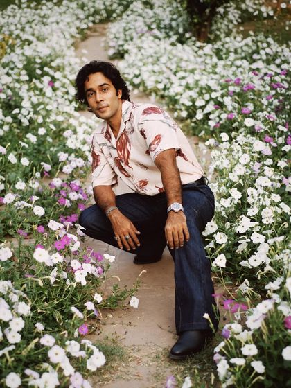 A slightly different angle of Zahan Kapoor in the flower patch, showing more of the path and creating a sense of journey.