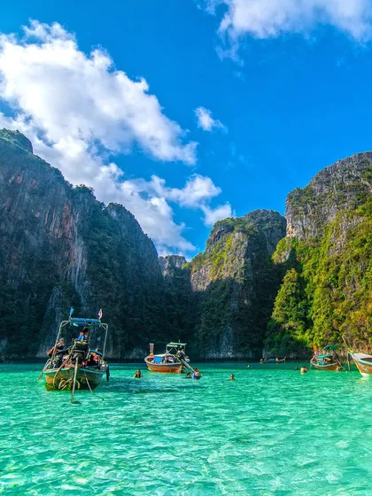 Crystal clear waters and dramatic cliffs at Maya Bay. I arrange boat tours to these world famous locations so your group can experience the best of Thailand's natural beauty.