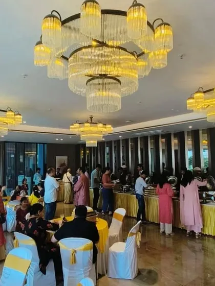 From intimate parties to large-scale events for 300+ guests, we handle it all. This image captures the grand atmosphere of a house warming ceremony we catered at Lodha WhiteCity, showcasing the full dining experience.
