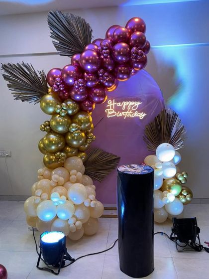 An elegant and unique color combination of purple, gold, and cream. This balloon arrangement with dried palm leaves shows how I can create a sophisticated look for any birthday.