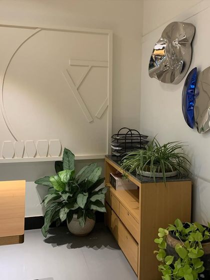 This corner of my office features an abstract wall treatment and metallic art pieces. The wall was originally uneven, so instead of leveling it, I chose to embrace its imperfection and turn it into a unique, seamless feature.