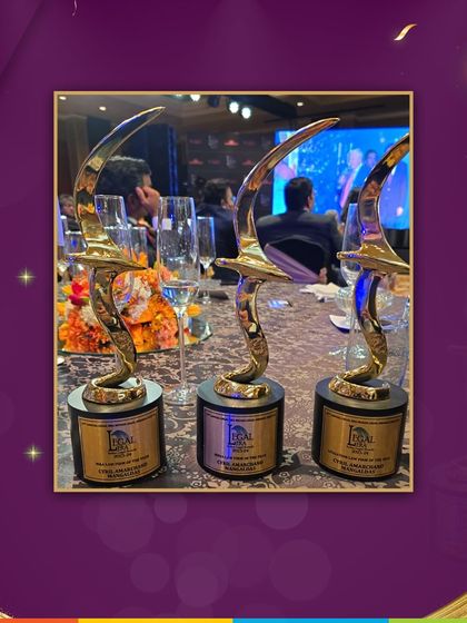 The trophies from the 13th Annual Legal Era Awards 2023-24, where we won 'India Law Firm of the Year', 'Litigation Firm of the Year', and 'M&A Firm of the Year'.