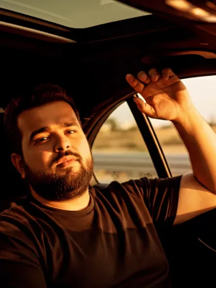 A candid shot from inside a car, capturing the feeling of a journey. Music is a journey, and I create the soundtrack for it, whether it's a long drive or a night out.