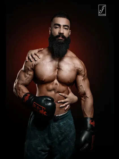 Incorporating boxing gloves for a fighter-style portrait. The addition of a woman's hands adds a layer of intimacy and artistry, making the image more than just a fitness photo.