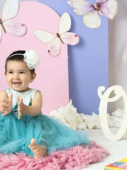 A magical unicorn and butterfly theme for a first birthday. The pastel colors, whimsical props, and dreamy backdrop create a true fairy tale setting.