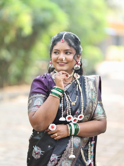 A close-up view of the delicate halwyache dagine and the traditional Maharashtrian nath.